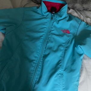 Blue and pink north face jacket